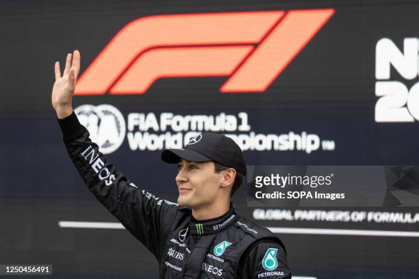 George Russell of Great Britain and Mercedes-AMG PETRONAS Formula One Team waves to the crowd after qualifying ahead of the Formula One Australian...