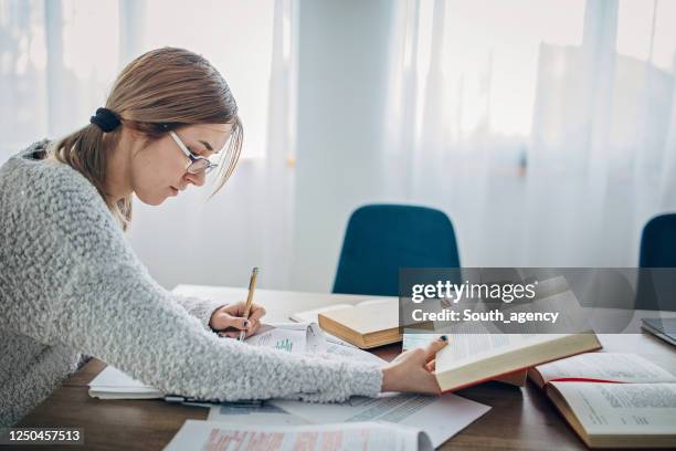 one female student studying for exam - test preparation stock pictures, royalty-free photos & images