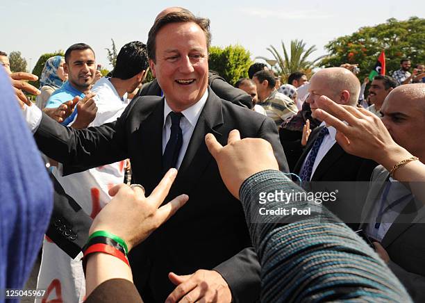 British Prime Minister David Cameron meets patients and staff at the Tripoli Medical Centre as part of their trip following the country's revolution...
