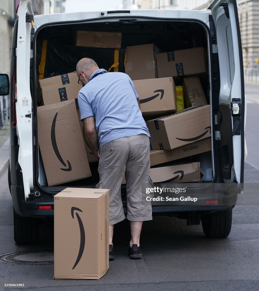 Amazon Delivery Ineterface A courier unloads Amazon packages during a delivery on June 18, 2020 ...