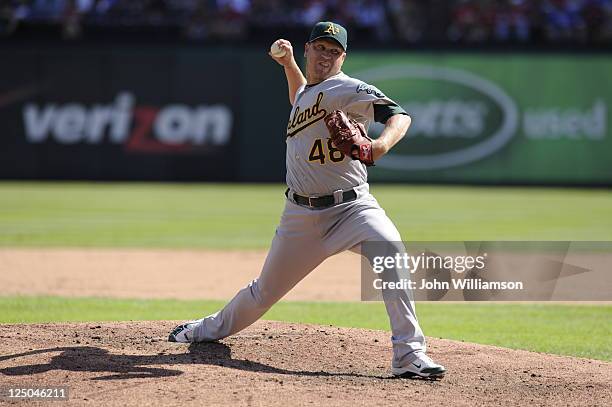 Michael Wuertz of the Oakland Athletics pitches against the Texas Rangers at Rangers Ballpark on September 11, 2011 in Arlington, Texas. The Texas...