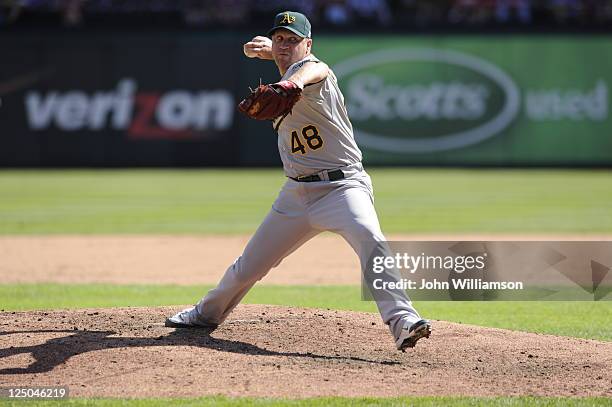 Michael Wuertz of the Oakland Athletics pitches against the Texas Rangers at Rangers Ballpark on September 11, 2011 in Arlington, Texas. The Texas...