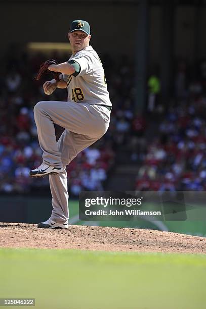 Michael Wuertz of the Oakland Athletics pitches against the Texas Rangers at Rangers Ballpark on September 11, 2011 in Arlington, Texas. The Texas...