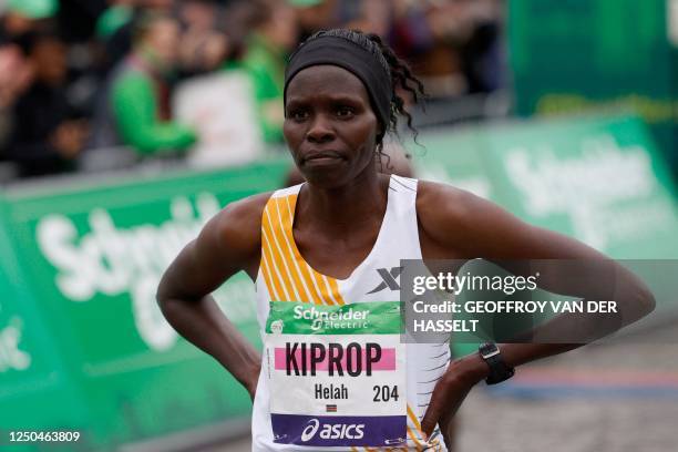 Kenya's Helah Kiprop crosses the finish line at the Arc de Triomphe to win the women's 2023 Paris Marathon, in Paris on April 2, 2023. 195 km-route...