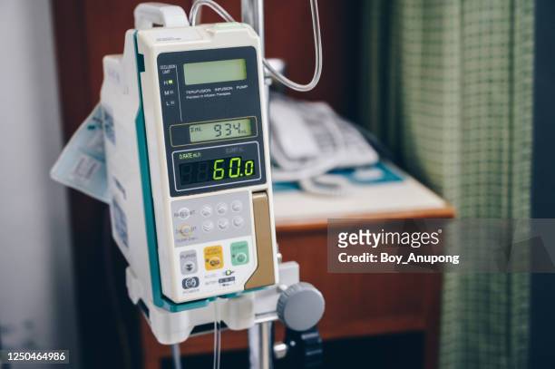 an infusion pump use in clinical settings such as hospitals or nuring home. - infused - fotografias e filmes do acervo