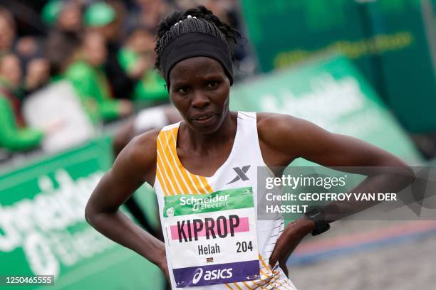 Kenya's Helah Kiprop crosses the finish line at the Arc de Triomphe to win the women's 2023 Paris Marathon, in Paris on April 2, 2023. 195 km-route...