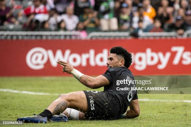 New Zealands Ngarohi McGarvey-Black gestures after scoring a try against France on the third day of the Hong Kong Sevens rugby tournament on April 2,...