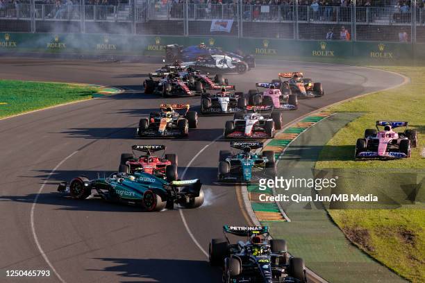 Second restart crash at turn 1 between Fernando Alonso of Spain and Aston Martin Aramco Cognizant F1 Team and Carlos Sainz Jr of Spain and Scuderia...
