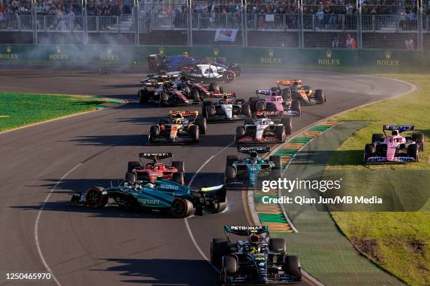 Second restart crash at turn 1 between Fernando Alonso of Spain and Aston Martin Aramco Cognizant F1 Team and Carlos Sainz Jr of Spain and Scuderia...