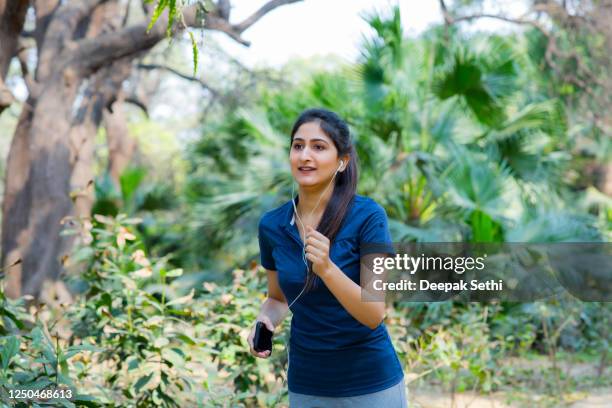 young woman - stock images - morning walk stock pictures, royalty-free photos & images