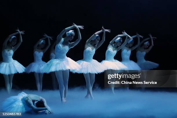 Dancers of The Shanghai Ballet perform 'Swan Lake' on the stage during a rehearsal at Shanghai Grand Theatre one day before the reopening on June 17,...