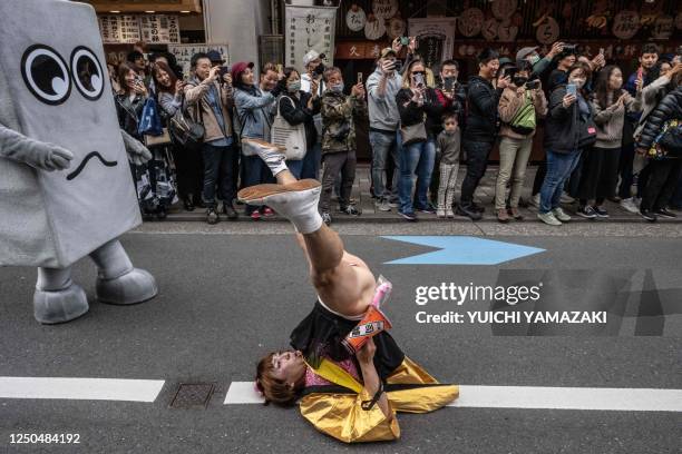 Participant dances during the Kanamara festival in Kawasaki on April 2, 2023.