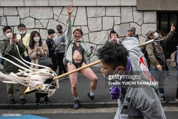 People enjoy a parade during the Kanamara festival in Kawasaki on April 2, 2023.