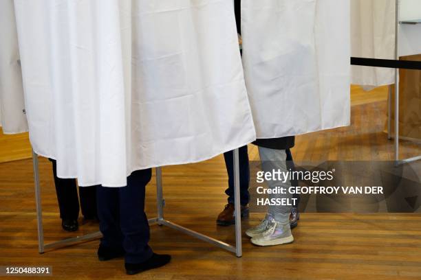 This photograph taken on April 2 shows voters preparing their votes in voting booths during a municipal public "citizen vote" voting session on...