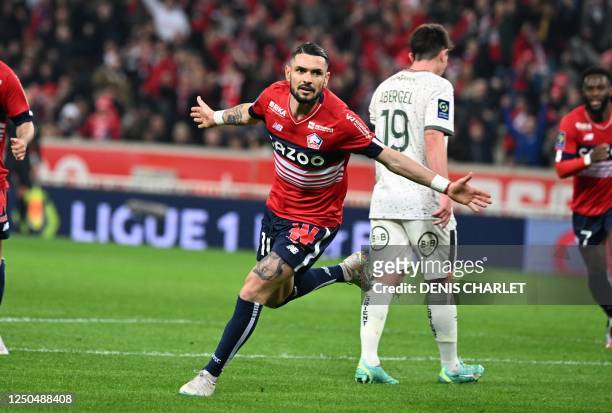 Lille's French midfielder Remy Cabella celebrates after scoring the opening goal during the French L1 football match between Lille LOSC and FC...