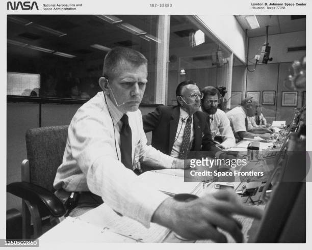 Chief of Johnson Space Center's flight control division M P Frank and flight controllers and flight controllers including S David Griggs , Robert L...