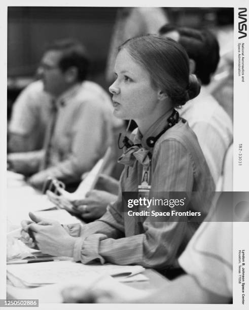 American Flight Activities Officer Marianne J Dyson, a member of the STS-4 entry team, at the console in the mission operations control room at...