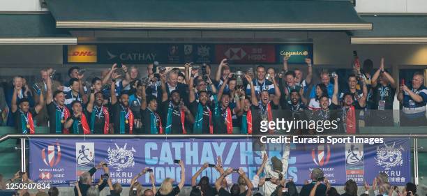 Team New Zealand poses for a photo with the trophy after winning the men's final match during the Hong Kong Sevens at Hong Kong Stadium on April 2,...