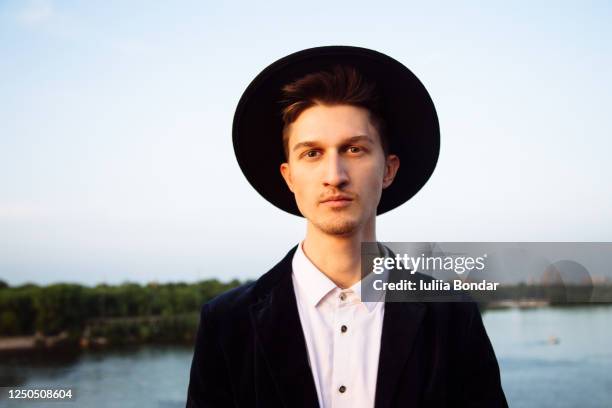 a young man stands in the river - hot young male models stock pictures, royalty-free photos & images