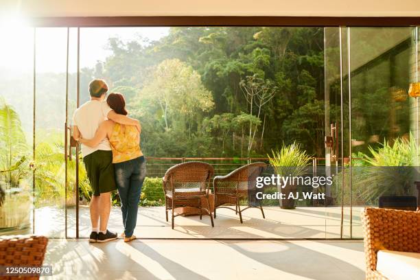 admiring the view - couple balcony stock pictures, royalty-free photos & images