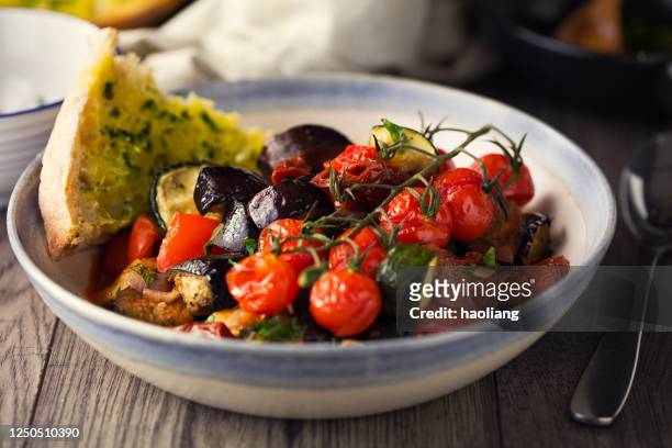 vegan ratatouille with crispy garlic bread - ratatouille stock pictures, royalty-free photos & images