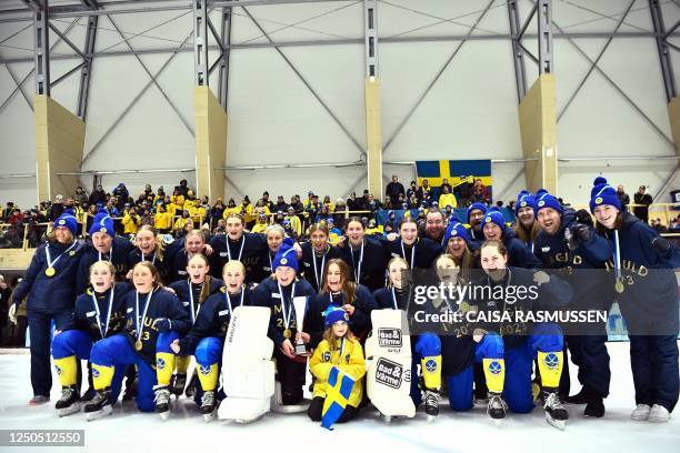 The Swedish women's team celebrates after winning gold after the Bandy World Championships final match between Sweden and Finland in the Eriksson...