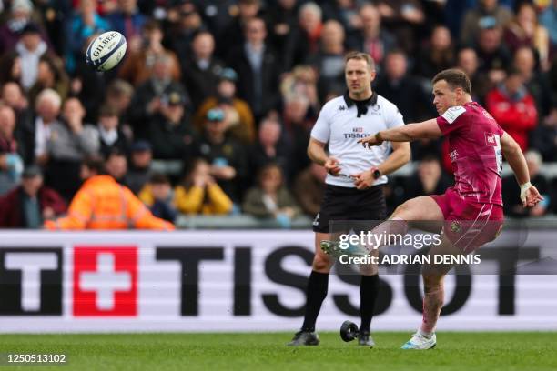 Exeter Chiefs' English fly-half Joe Simmonds kicks the ball to convert the last try of his team during the European Rugby Champions Cup, Round of 16...