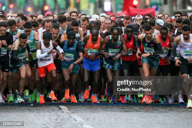 Runners in the &lt;&lt; Elite &gt;&gt; category take the start on the Champs-Elysees avenue during the 46th edition of the Paris Marathon 195 km, on...