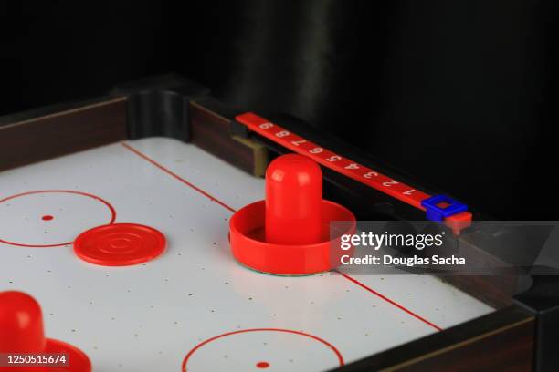 air hockey game board with puck - air hockey puck stock pictures, royalty-free photos & images