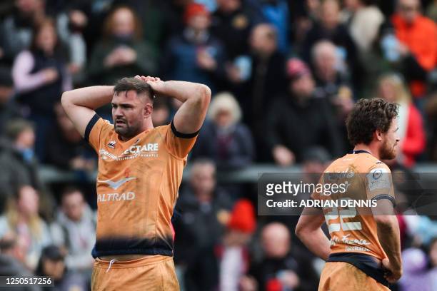 Montpellier's English lock Elliott Stooke and Montpellier's George Bridge react following Exter last try scored during the European Rugby Champions...