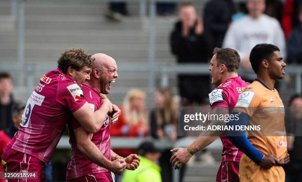 Exeter Chiefs' English hooker Jack Yeandle celebrates with teammates after scoring the last try of his team during the European Rugby Champions Cup,...