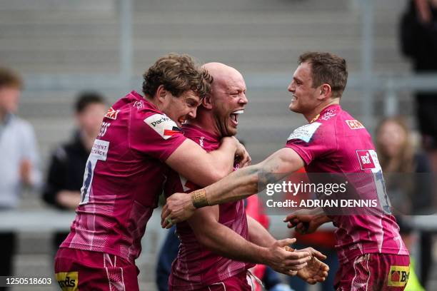 Exeter Chiefs' English hooker Jack Yeandle celebrates with teammates after scoring the last try of his team during the European Rugby Champions Cup,...