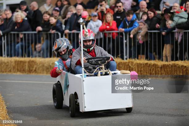 Plumber contestants drive their bath and shower kart down the course during the 70 year anniversary soap box derby on April 02, 2023 in Hunstanton,...