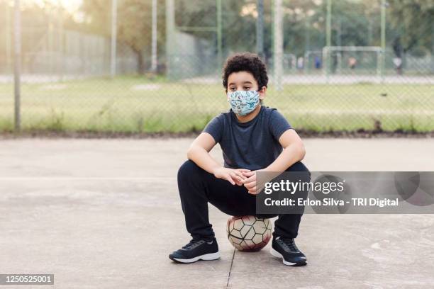 Social Distance Outside Playing The Boys Playing Football On The Playground Photos and Premium High Res ...