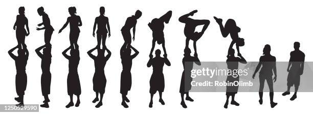 acrobat silhouettes - trust exercise stock illustrations