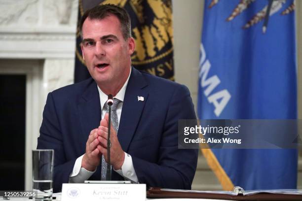 Governor Kevin Stitt speaks during a roundtable at the State Dining Room of the White House June 18, 2020 in Washington, DC. President Trump held a...