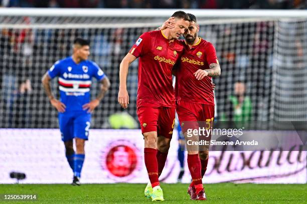 Nemanja Matic and Leonardo Spinazzola of Roma celebrate after Georginio Wijnaldum of Roma has scored a goal during the Serie A match between AS Roma...