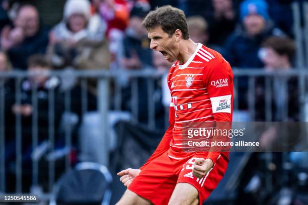 April 2023, Bavaria, Munich: Soccer: Bundesliga, Bayern Munich - Borussia Dortmund, Matchday 26, Allianz Arena. Munich's Thomas Müller celebrates...