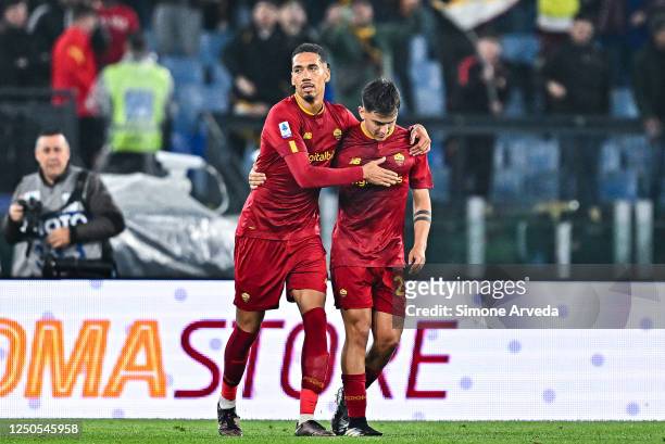 Paulo Dybala of Roma celebrates with his team-mate Christopher Smalling after scoring a goal on a penalty kick during the Serie A match between AS...