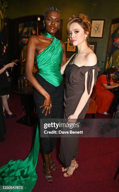 Sheila Atim and Aimee Lou Wood pose backstage at The Olivier Awards 2023 at Royal Albert Hall on April 2, 2023 in London, England.