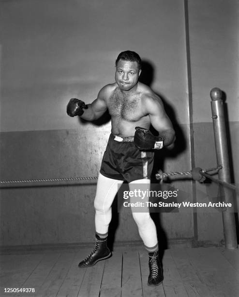 Light heavyweight professional boxer Archie Moore of the United States poses for a portrait in the ring circa 1956 at Stillman's Gym in New York, New...