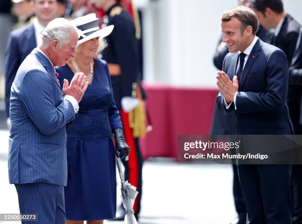 Prince Charles, Prince of Wales, accompanied by Camilla, Duchess of Cornwall, and French president Emmanuel Macron make namaste hand gestures as they...