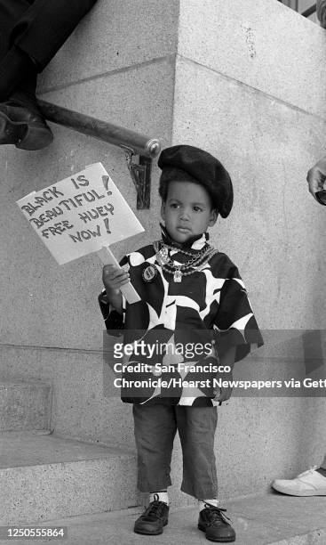 Young demonstrator participates in a support rally outside the Alameda County Courthouse in Oakland, Calif. On July 17, 1968 during the Huey Newton...