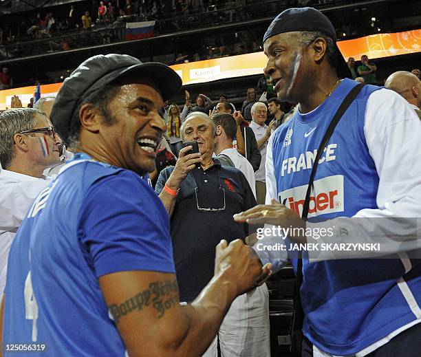 Frenchformer tennis player and father of basketball player Joakim Noah, Yannick Noah shakes hands with Tony Parker senior, father of Tony Parker...