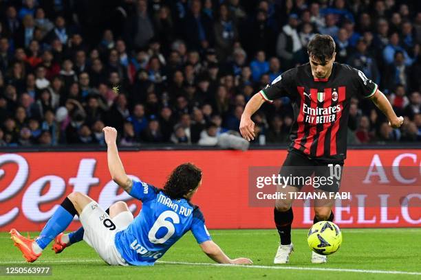 Milan's Spanish midfielder Brahim Diaz dribbles Napoli's Portuguese defender Mario Rui prior to shoot to score his side's second goal during the...