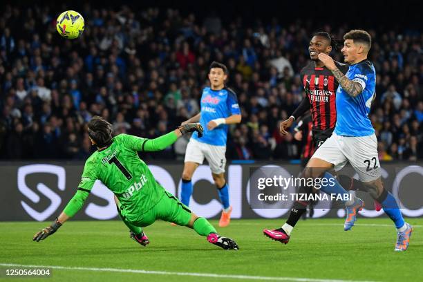 Milan's Portuguese forward Rafael Leao opens the scoring past Napoli's Italian goalkeeper Alex Meret during the Italian Serie A football match...