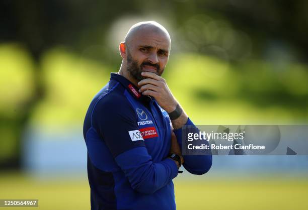 Rhyce Shaw coach of the Kangaroos looks on during a North Melbourne Kangaroos training session at Arden Street Ground on June 19, 2020 in Melbourne,...