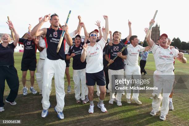 The Lancashire players celebrate clinching the Championship during the LV County Championship match between Somerset and Lancashire at the County...