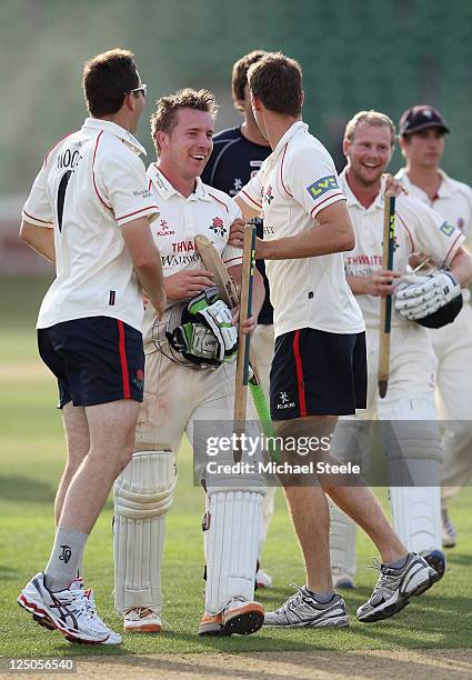 Steven Croft and Karl Brown are applauded on the field after hitting the winning runs during the LV County Championship match between Somerset and...