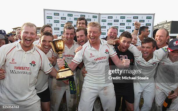Lancashire captain Glenn Chapple leads the Championship winning celebrations during the LV County Championship match between Somerset and Lancashire...